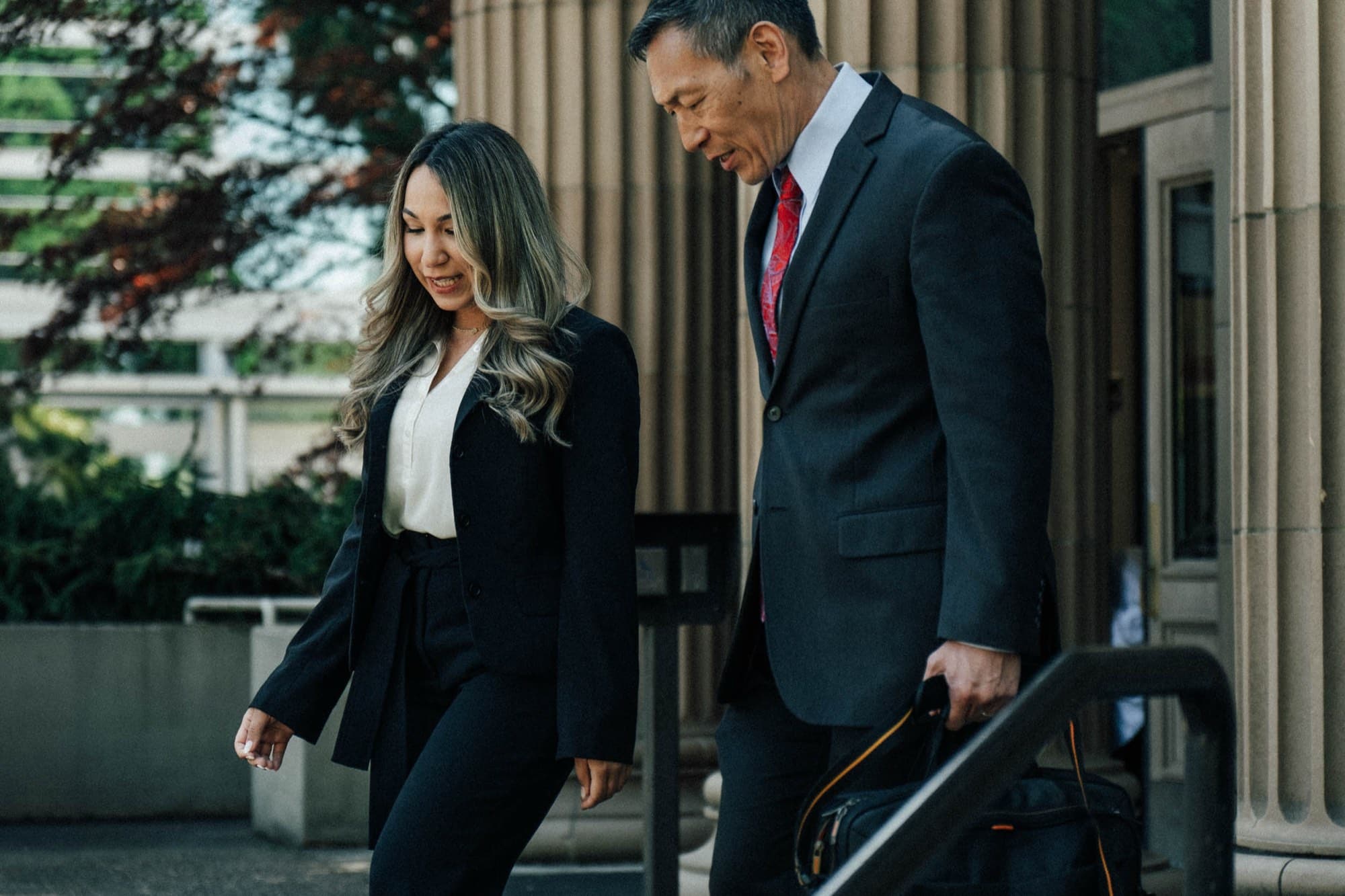 Vames Wang Sosa Hood attorneys Emery Wang and Jarely Castro outside an Oregon courthouse